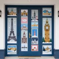 A sophisticated travel-themed winter door featuring snowy landmarks (Eiffel Tower, Big Ben, Jerusalem, etc.) with
